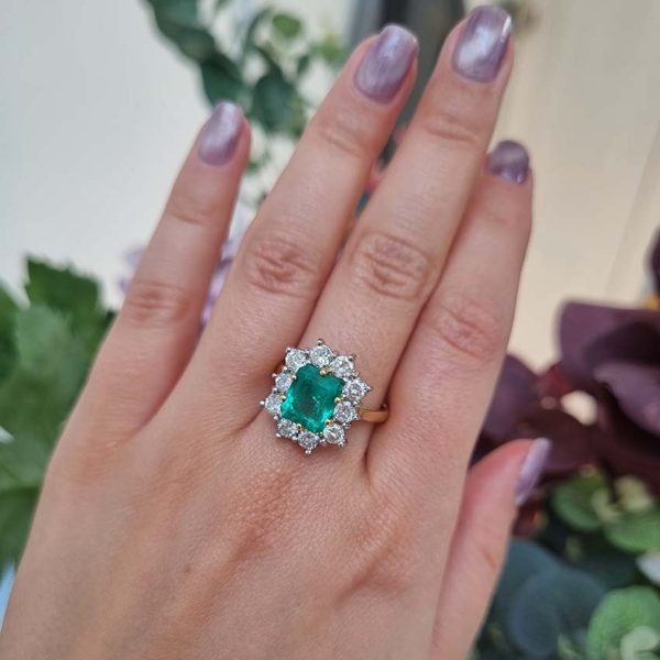 Vintage 2.91ct Emerald and Diamond Cluster Engagement Ring, 2.91ct emerald-cut emerald surrounded by 1.50 carats of sparkling round brilliant-cut diamonds in 18ct yellow gold