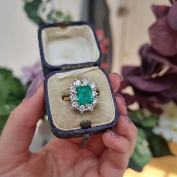 Vintage 2.91ct Emerald and Diamond Cluster Engagement Ring, 2.91ct emerald-cut emerald surrounded by 1.50 carats of sparkling round brilliant-cut diamonds in 18ct yellow gold