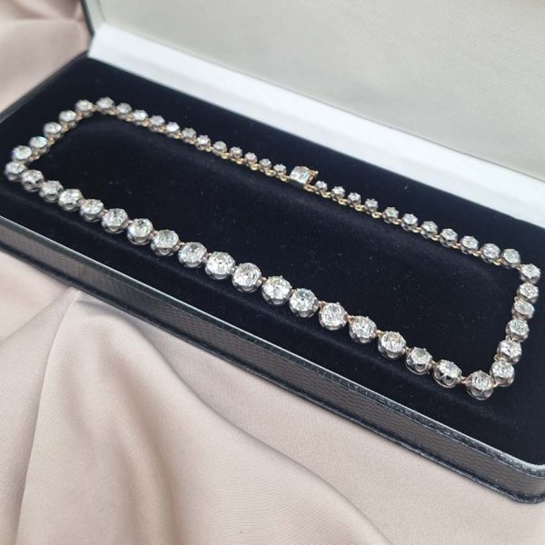 Victorian Antique 40cts Old Cut Diamond Line Riviere Necklace, 54 old-cut diamonds totalling 40 carats in silver-upon-gold crown claw settings. Late 19th century Circa 1880