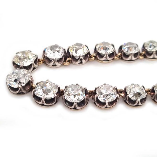 Victorian Antique 40cts Old Cut Diamond Line Riviere Necklace, 54 old-cut diamonds totalling 40 carats in silver-upon-gold crown claw settings. Late 19th century Circa 1880