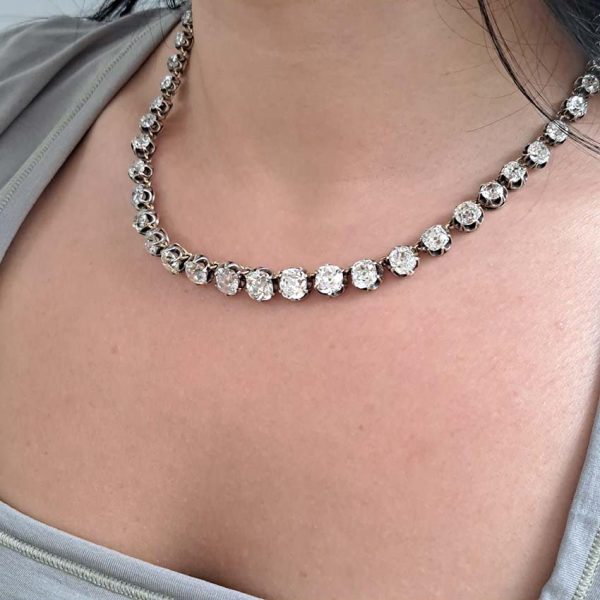 Victorian Antique 40cts Old Cut Diamond Line Riviere Necklace, 54 old-cut diamonds totalling 40 carats in silver-upon-gold crown claw settings. Late 19th century Circa 1880