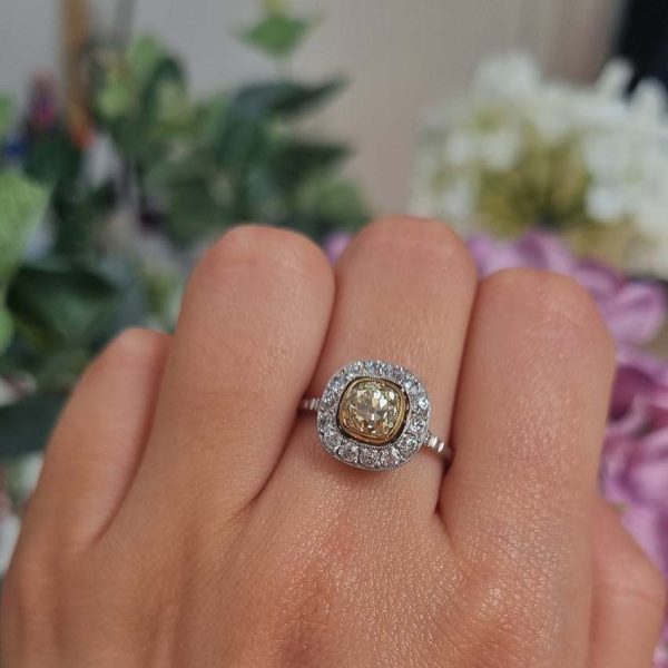 Antique 1.17ct Old Mine Cut Yellow Diamond Cluster Engagement Ring in Platinum, 1.17ct old mine-cut yellow diamond surrounded by halo of white diamonds