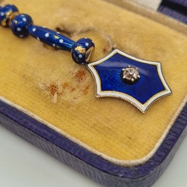 Edwardian Antique Blue Enamel and Diamond Cufflinks, fine six-pointed stars blue enamel central old mine-cut diamond white enamel border to fancy baton shaped fasteners decorated with blue enamel with white enamel polka dots accents in 18ct yellow gold