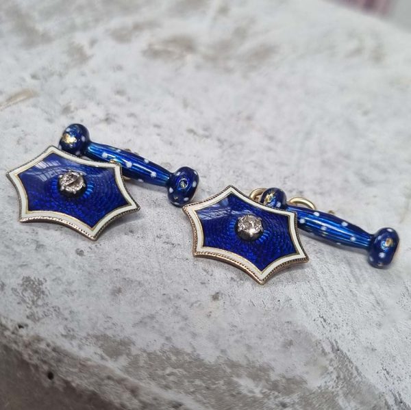 Edwardian Antique Blue Enamel and Diamond Cufflinks, fine six-pointed stars blue enamel central old mine-cut diamond white enamel border to fancy baton shaped fasteners decorated with blue enamel with white enamel polka dots accents in 18ct yellow gold