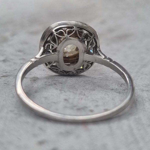 Antique 1.17ct Old Mine Cut Yellow Diamond Cluster Engagement Ring in Platinum, 1.17ct old mine-cut yellow diamond surrounded by halo of white diamonds