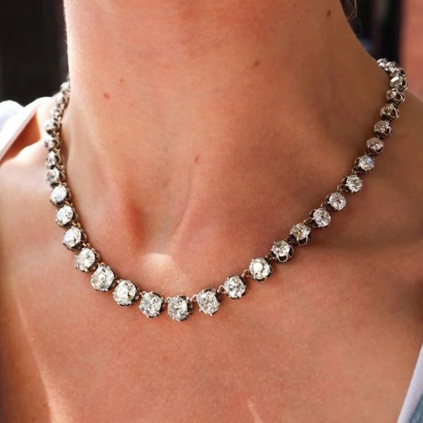 Victorian Antique 40cts Old Cut Diamond Line Riviere Necklace, 54 old-cut diamonds totalling 40 carats in silver-upon-gold crown claw settings. Late 19th century Circa 1880