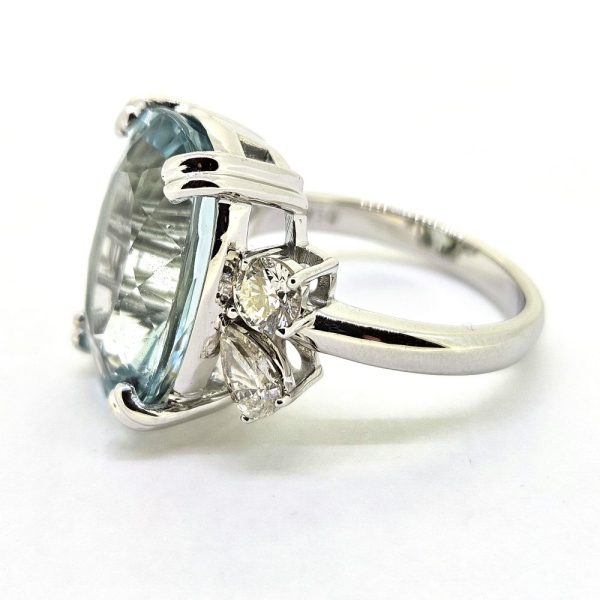 9.95ct Aquamarine and Diamond Statement Cocktail Ring, 9.95ct oval aquamarine accented with sparkling diamonds to each side in 18ct white gold