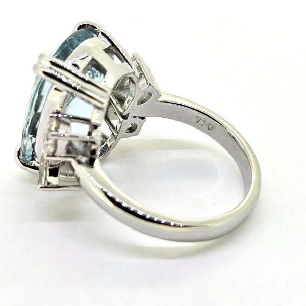 9.95ct Aquamarine and Diamond Statement Cocktail Ring, 9.95ct oval aquamarine accented with sparkling diamonds to each side in 18ct white gold