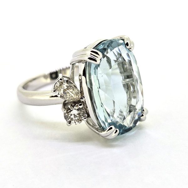 9.95ct Aquamarine and Diamond Statement Cocktail Ring, 9.95ct oval aquamarine accented with sparkling diamonds to each side in 18ct white gold