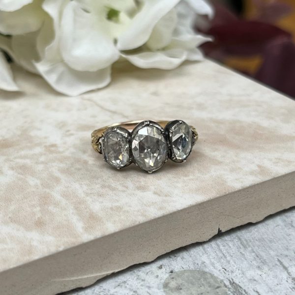 Antique 19th century three stone diamond ring in 18ct yellow gold and silver with rose-cut diamonds