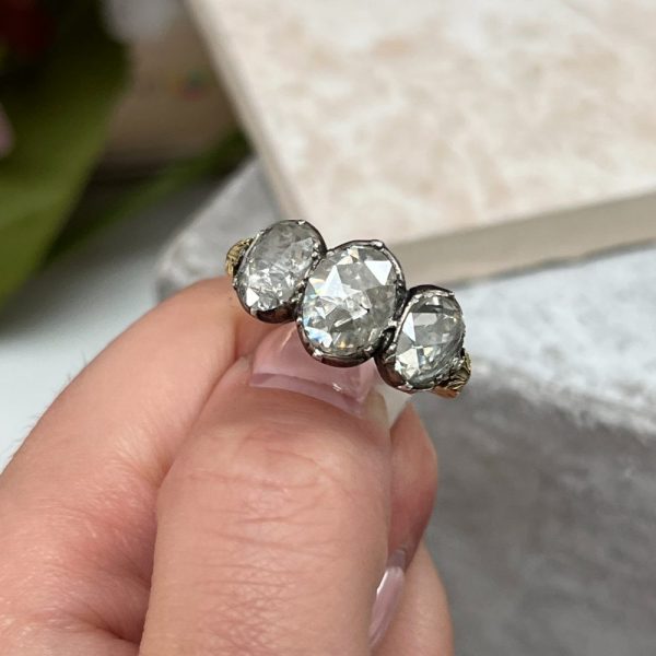 Antique 19th century three stone diamond ring in 18ct yellow gold and silver with rose-cut diamonds