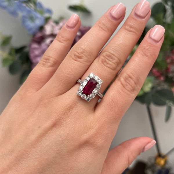 Natural no heat pigeon blood ruby and diamond cluster ring in platinum with diamond halo and GRS certification.