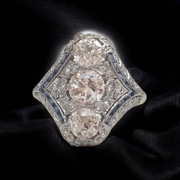 Antique Art Deco Edwardian diamond and Sapphire dinner ring, the eye catching cocktail ring set with old cut diamonds in platinum, milliegrain setting 1920s