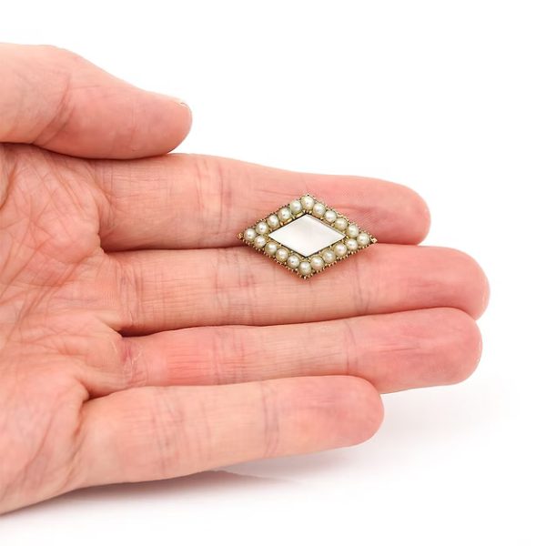 Antique Victorian 18ct gold rhomboid mourning brooch with original split pearls and a carved central pearl panel, circa 1880.