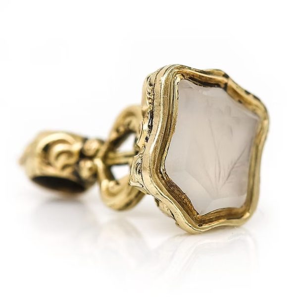 Mini Victorian 9ct gold fob seal with chalcedony shield base engraved with forget-me-not flower and lyre motif detailing, circa 1880
