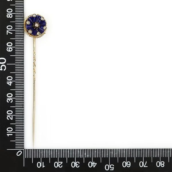 Antique Victorian 15ct gold stick pin featuring dark blue enamel and rose-cut diamonds in a floral ribbon design, circa 1890