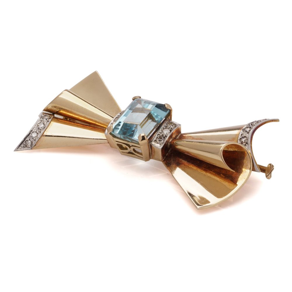 Vintage aquamarine and diamond bow brooch in gold and platinum.
