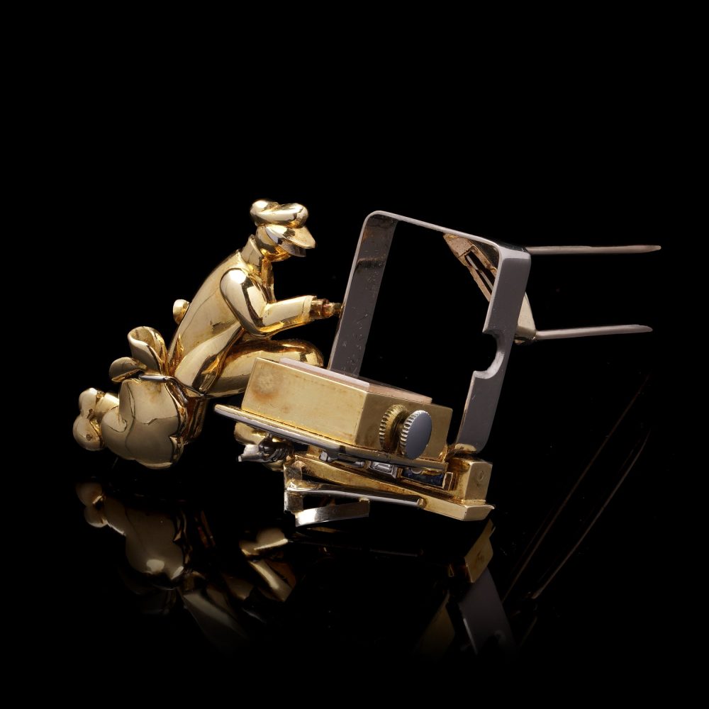 Vintage gold brooch/watch set with gemstones.