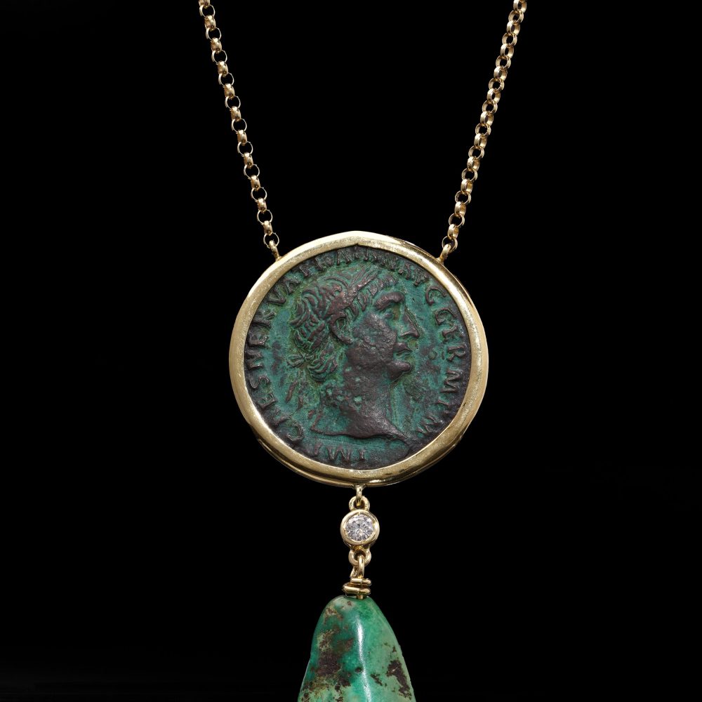 Gold necklace with trajan coin, turquoise drop and diamond.