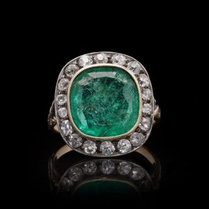 Antique emerald and diamond ring in gold.