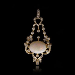 Vintage opal and diamond pendant/brooch in gold.