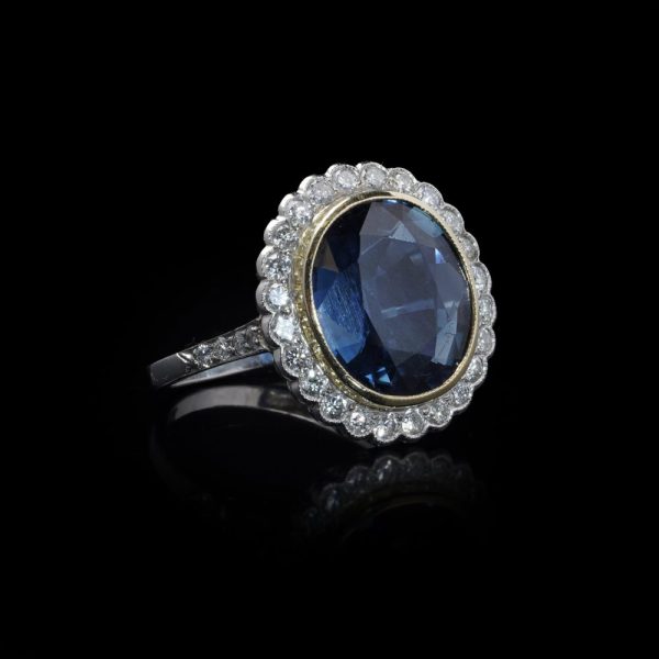 Certified 6ct Natural No Heat Sapphire and Diamond Cluster Ring, certified natural unheated sapphire framed by scalloped halo of 32 brilliant-cut diamonds in 18ct gold and platinum