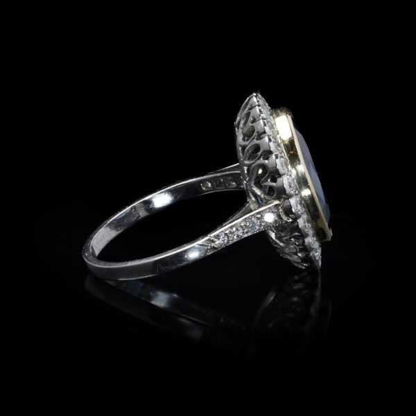 Certified 6ct Natural No Heat Sapphire and Diamond Cluster Ring, certified natural unheated sapphire framed by scalloped halo of 32 brilliant-cut diamonds in 18ct gold and platinum