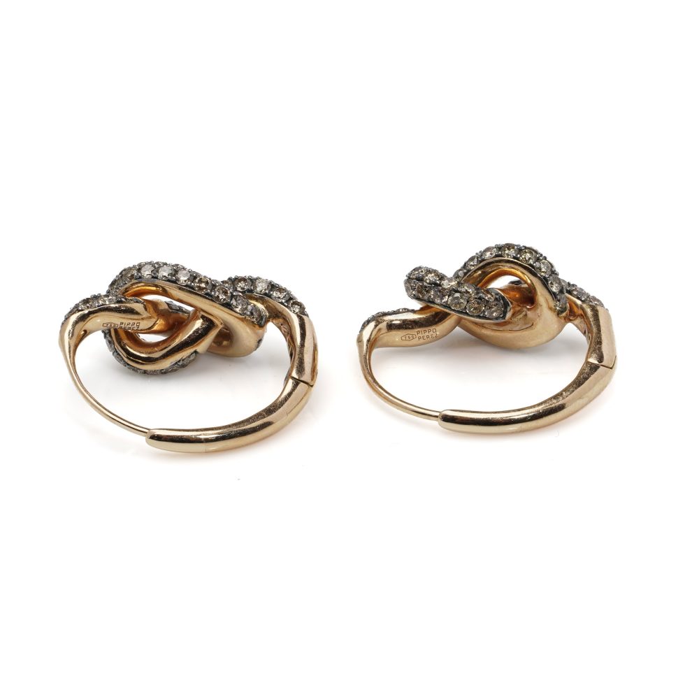Pippo Perez diamond knot earrings in gold.