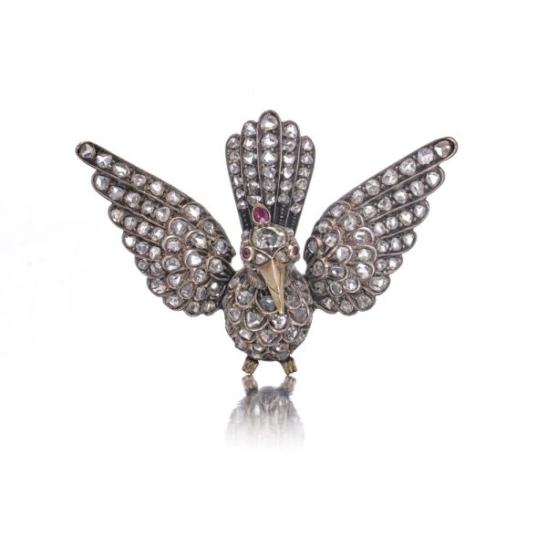 Victoria diamond bird brooch in gold and silver.