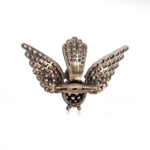 Victoria diamond bird brooch in gold and silver.