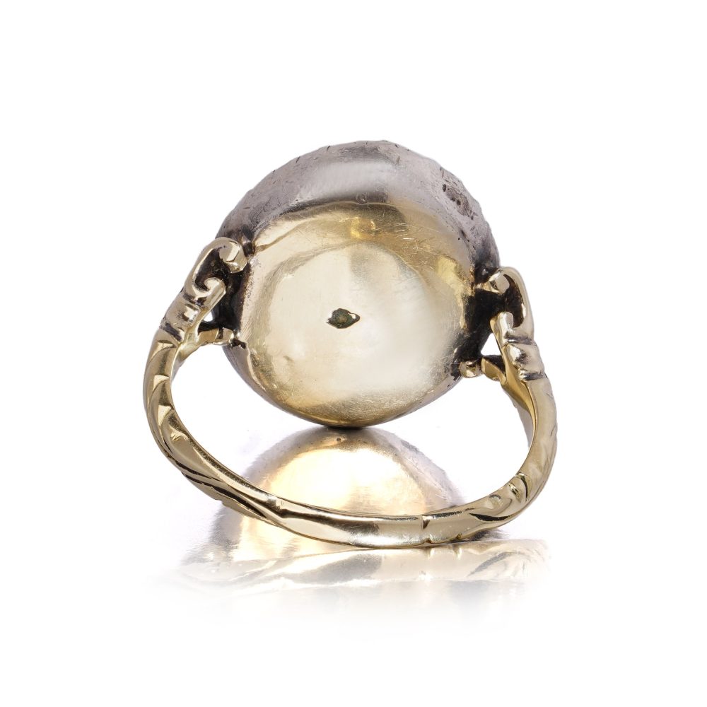 Antique diamond cluster ring in gold and silver.