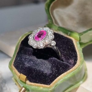 Pink Sapphire and Diamond Cluster Engagement Ring in Platinum, 1.21ct oval pink sapphire surrounded by 1cts sparkling brilliant-cut diamonds