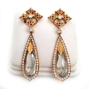 Aquamarine Diamond Cluster Drop Earrings by Theo Fennell, long teardrop shaped aquamarines surrounded by diamond halo borders suspended from diamond and ruby set tops in yellow gold