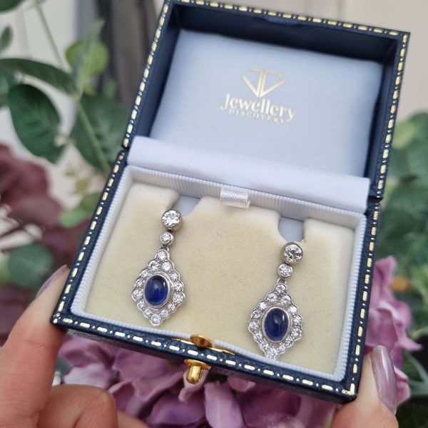 Cabochon Sapphire and Diamond Cluster Drop Earrings with Detachable Stud Tops, oval cabochon sapphires set within diamond studded navette cluster surrounds in 18ct white gold