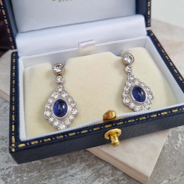 Cabochon Sapphire and Diamond Cluster Drop Earrings with Detachable Stud Tops, oval cabochon sapphires set within diamond studded navette cluster surrounds in 18ct white gold