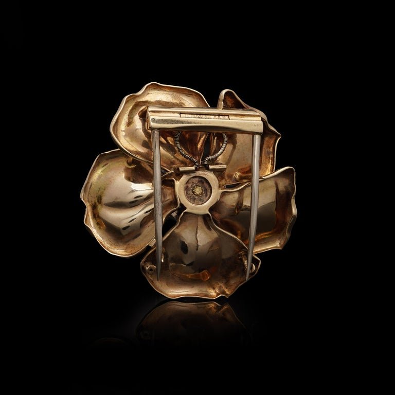 Vintage diamond and turquoise flower brooch in gold.