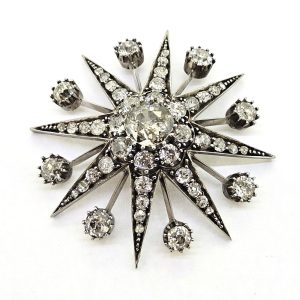 Antique Old Cut Diamond Star Brooch, 7.45 carat total, central 2.15ct old-cut diamond leads to eight star-points set with graduating old-cut diamonds with a diamond ray between