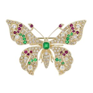 Emerald Ruby and Cognac Diamond Butterfly Brooch, adorned with rich green emeralds and fiery red ruby accents with light brown cognac diamonds in 14ct yellow gold