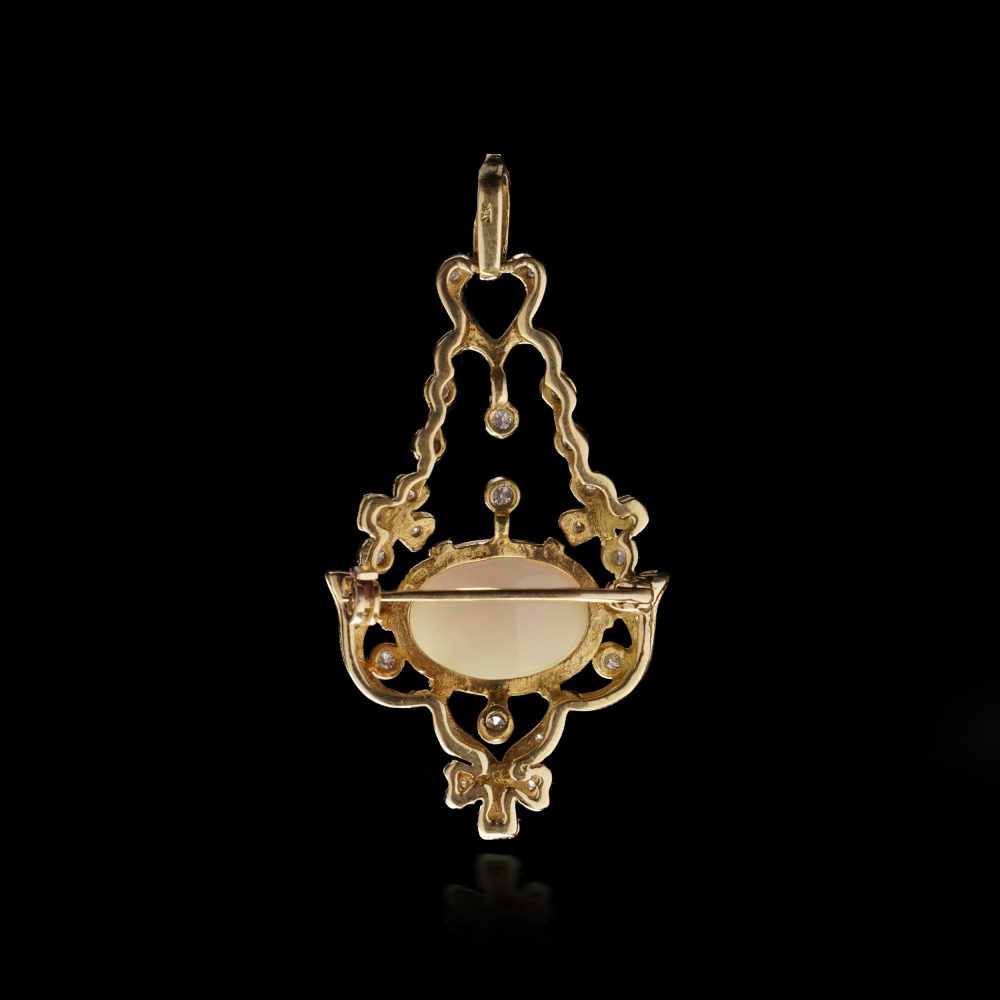 Vintage opal and diamond pendant/brooch in gold.