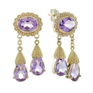 Vintage Style 6.90ct Amethyst Double Drop Earrings in 9ct Yellow Gold, Oval amethyst tops framed in a delicate gold floral designs suspend two pear teardrop-shaped amethysts