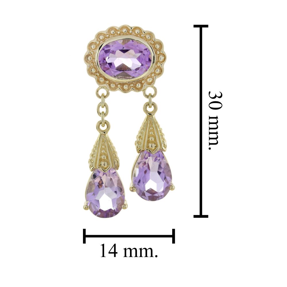 Vintage Style 6.90ct Amethyst Double Drop Earrings in 9ct Yellow Gold, Oval amethyst tops framed in a delicate gold floral designs suspend two pear teardrop-shaped amethysts