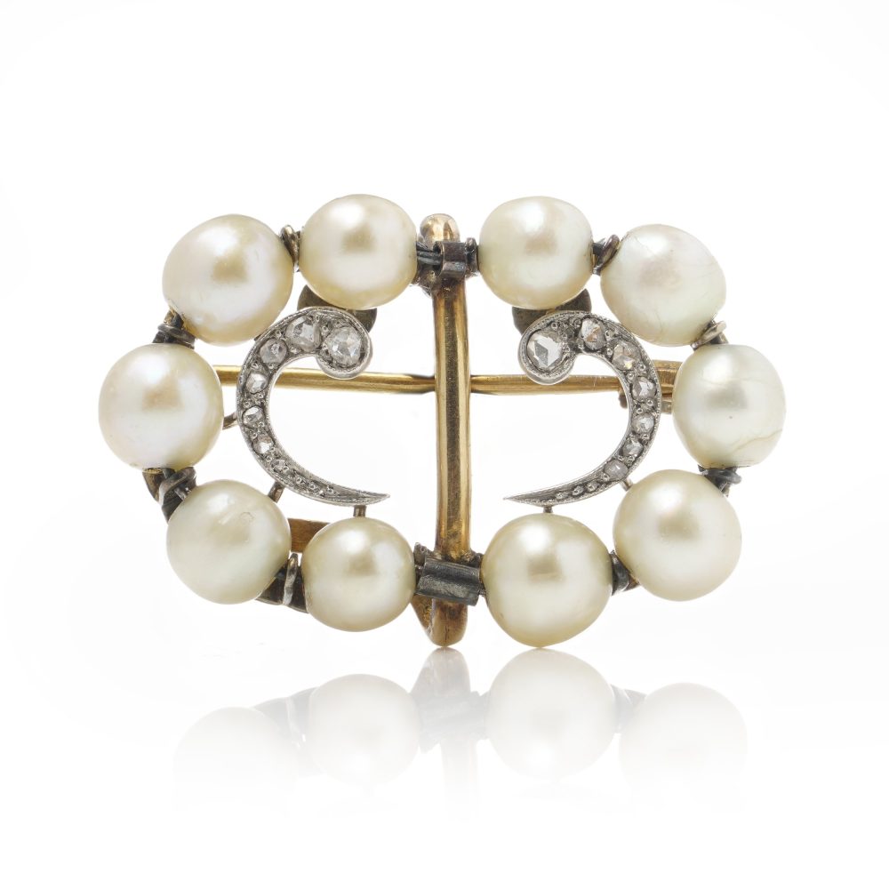 Edwardian pearl and diamond brooch in platinum and gold.