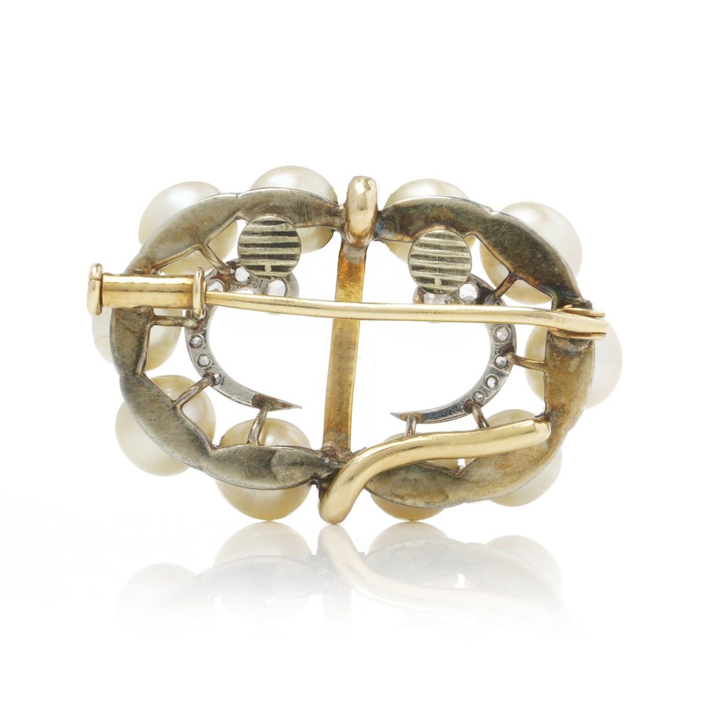 Edwardian pearl and diamond brooch in platinum and gold.