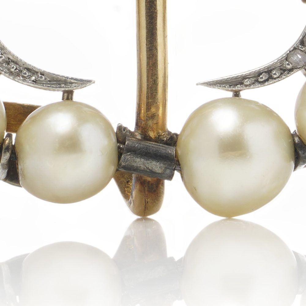 Edwardian pearl and diamond brooch in platinum and gold.