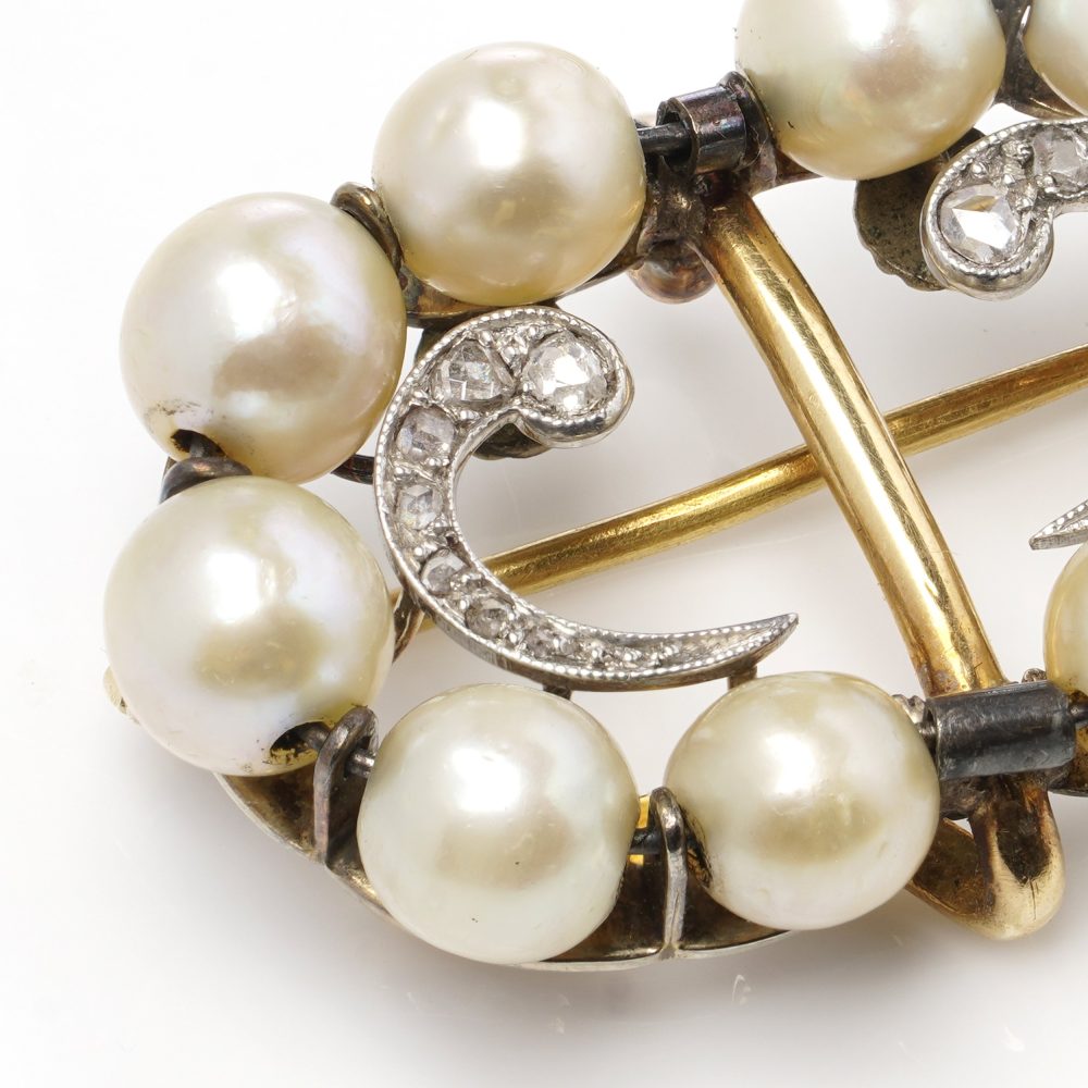 Edwardian pearl and diamond brooch in platinum and gold.