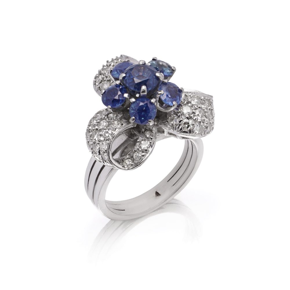 Diamond and sapphire cluster ring in white gold.