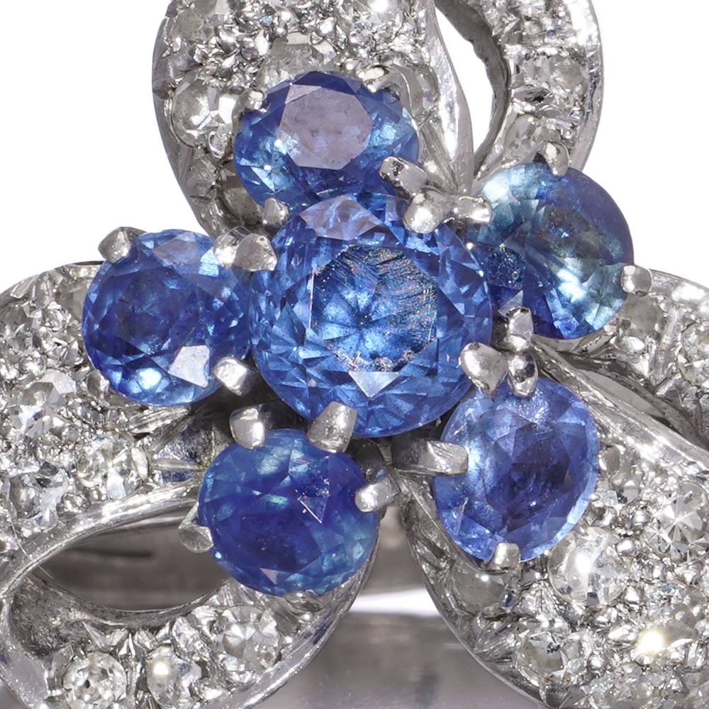 Diamond and sapphire cluster ring in white gold.