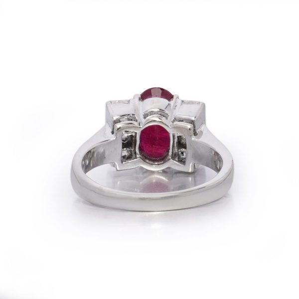 2.15ct Oval Ruby and Princess Cut Diamond Engagement Ring, vibrant oval mixed-cut natural ruby flanked by a row of vertically set square princess-cut diamonds to each side in 18ct white gold