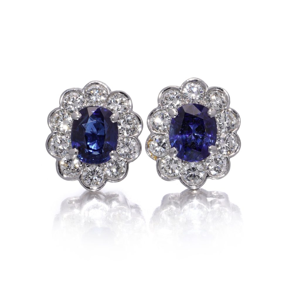 Sapphire and diamond cluster earrings in white gold.