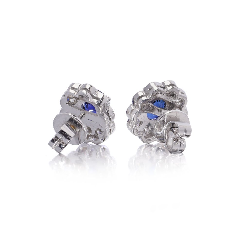 Sapphire and diamond cluster earrings in white gold.
